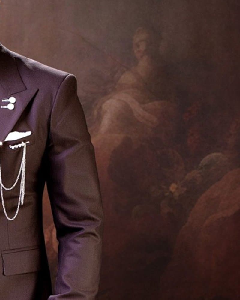 Gold lapel chain.